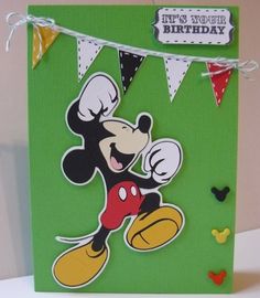 a mickey mouse birthday card on a table