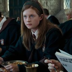 a group of people sitting at a table eating food