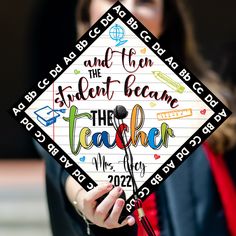 a woman holding up a graduation cap with writing on it and the words, and then the student beam