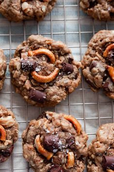 cookies with nuts and chocolate chips on a cooling rack