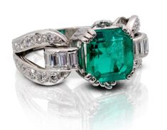 18k White Gold Antique Emerald Cut 3.24ct Emerald (Medium Light/Moderately Strong/Slightly Bluish Green/ SI) and Diamond Ring with 10 Baguette Diamonds = Approximately 0.70ctw and approximately 0.60ctw of 28 round diamonds. Total Ring Weight is 11.4g. Colored Diamonds Engagement, Emerald Ring White Gold, Emerald Ring Vintage, Emerald Ring Gold, Colored Gemstones, Ruby Diamond Rings, Sparkly Things, Watch Repair, Baguette Diamonds