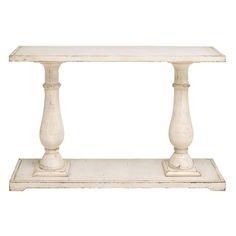 a white table with two pillars on top