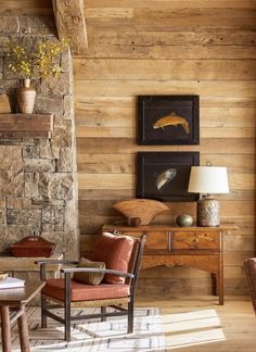 a living room filled with furniture and a fire place in front of a stone fireplace