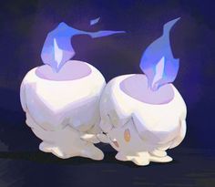 two white vases with blue flames on them sitting in front of a dark background