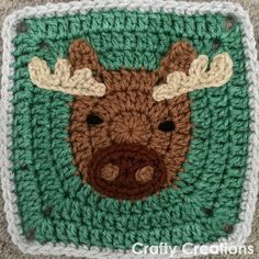 a crocheted square with a moose's head on it