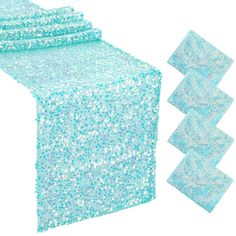 blue sequin table runner with matching placemats and napkins on white background