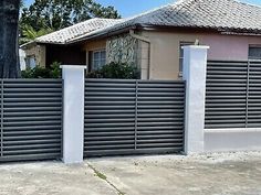 a house that has a fence in front of it