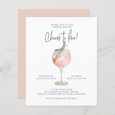 a pink and white card with the words cheers to have written in black ink on it