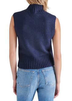 Stay cozy in the Serin Sweater! Made from a rib knit fabrication, this turtleneck sweater is sleeveless and easy to pull on. Perfect for layering or wearing on its own. Sleeveless. Mock neck knit top. 100% Polyester. Model is wearing a size S. Sleeveless Turtleneck Sweater, Sleeveless Turtleneck Sweaters, Turtleneck Sleeveless, Autumn Days, Knit Bottom, Loungewear Jumpsuit, Sleeveless Turtleneck, Football Tees, Trendy Style