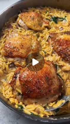 chicken and pasta in a skillet with a spoon