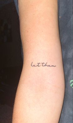 a person with a small tattoo on their arm