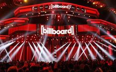 the stage is lit up with red and white lights