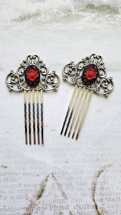 Cameo Pair Flower Haircomb This Cameo Pair Flower HairComb makes a lovely hair accessory for beautiful hair styles. This hair Comb is charming with elegant and amazing Red Rose Flower on a black Baroque Framework. It is great for special occasions like weddings, but can also be great for everyday wear. ☻Link to The ENTIRE SHOP: https://www.etsy.com/shop/FashionCrashJewelry?ref=shopsection_shophome_leftnav&ga_search_query=crystal%2Bnecklace Our Motto ~ Happy Customers Are Awesome Let us know of a Red Flower Jewelry With Rose Design, Rose Red Roses Wedding Jewelry, Hair Ornaments Red, Red Flower Hair Clip, Red Rose Hair Clip, Rose Hair Clip, Baroque Frames, Floral Comb, Red Rose Flower