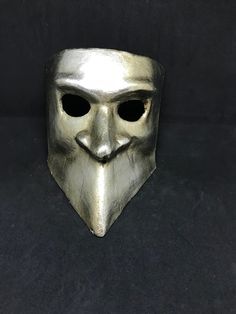 This masquerade mask for men belongs to our collection of historical masks: traditionally they were used in the past centuries in Venice. The name of this mask is Bauta and it was traditionally used by men. It is perfect for any masquerade party, Halloween costume, pro or event in Venice or elsewhere during Carnival. This mask can be gently bent to form to your face and ties in the back with two soft matching ribbons. Since the mask is handmade, your mask could be lightly different from the one Historical Masks, Bauta Mask, Mens Masquerade Mask, Mask For Men, Costume Masks, Venetian Masks, Venetian Mask, Masquerade Party, Costume Mask