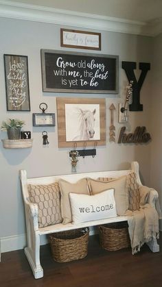 a living room filled with furniture and pictures on the wall