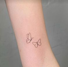 two butterflies tattoo on the wrist