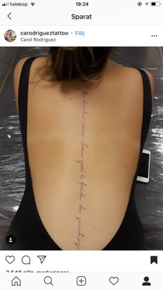 the back of a woman's body with writing on her left shoulder and right arm