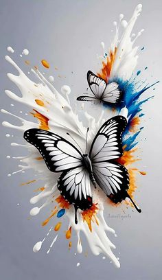 two butterflies flying in the air with paint splatters all over their body and wings