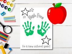 an apple and handprints are next to school supplies