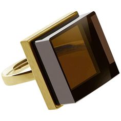 This contemporary jewelry ring, crafted in 14 karat yellow gold, features a natural smoky quartz measuring 15x15x8 mm and was showcased in both Harper's Bazaar and Vogue UA. The ring exudes an art deco aesthetic and is suitable for both women and men, drawing inspiration from architects and designers. Its sizable presence draws attention to the gem's stunning color and the brilliant rose or yellow gold it is set in. The gemstone features a unique cut and is set in an open design, allowing light to illuminate its beauty. This piece of jewelry symbolizes frozen ink and can be ordered in 14 or 18 karat white or yellow gold. Please be sure to contact the artist to specify your ring size. Contemporary Jewelry Rings, Ring Rosegold, Contemporary Ring, Gold Art Deco, Big Rings, Green Quartz, Amethyst Quartz, Gold Art, Art Deco Ring