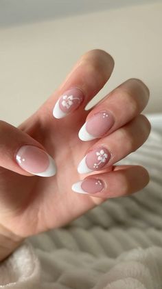 Nails With Lily Flower, White Almond French Tip Nails Design, Blended French Manicure, Winter Flower Nail Designs, White Almond French Tip Nails With Design, Simple Flower Acrylic Nails, French Tips With Nail Art, Almond Nails Designs Flowers, Simple Nails With Flowers