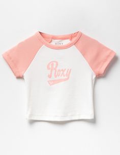 Roxy Script Raglan Tee. Allover Ribbed Texture. Roxy Script Screened On Front. Raglan Style. Crew Neck. Short Sleeve. 48% Cotton 48% Polyester 4% Spandex. Machine Wash. Imported. | Roxy Script Girls Raglan Tee Sporty Fitted Tops For Playwear, Playful Fitted Sports Top, Pink Summer Tops With Name Print, Pink Letter Print Tops For Playwear, Playful Crew Neck Top With Name Print, Cute Pink Sports Tops, Cute Cotton Sports Top, Sporty Pink Tops For Playwear, Sporty Pink Top For Playwear