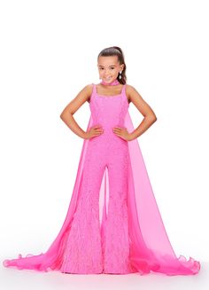 Ashley Lauren Kids 8210 Long Girls Pageant Jumpsuit with Crystal embellishments and a scoop neckline. Feather Embellished flared Bell Bottoms with a choker embellished with crystals and organza Cape. Feel like a popstar in this stunning jumpsuit! Covered in sparkly press on stones, this jumpsuit has a detached choker and organza cape. With feathers cascading down the pants, this jumpsuit is going to make a statement! Sizes: 4-16 Colors: Aqua, Hot Pink, Red Press On Stone Details Choker with Orga Christmas Outfit Of Choice Pageant, Pageant Fashion Wear, Pageant Jumpsuit, Organza Cape, Ashley Lauren, Pageant Wear, Toddler Birthday Gifts, Runway Outfits, Toddler Birthday