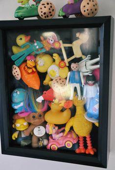 there are many toys in the shadow box