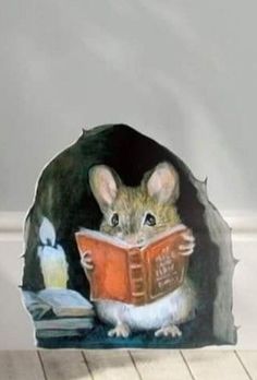 a mouse is reading a book while sitting on the floor