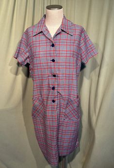 This is a cute vintage dress from the 60s or early 70s.  No labels or tags. The bust measures 44", waist 42", hip 44", see measurements below.  Made of a blue, red and white plaid lightweight, cotton blend. It is a shift style dress. It is short sleeve and has a big pointy collar.  Pockets on the front hip.  About knee length. Buttons in the front to below the waist with plastic buttons.  The dress is in good vintage condition. No damage.  No soil or stains. Cute!  Measurements were taken with the garment lying flat and without stretching. If you have never worn vintage before, please measure yourself or a similar garment that fits you well & compare the measurements to these.  Vintage sizes run smaller than today's sizes, you need to know your measurements! If you have any questions about Vintage Plaid Dress With Button Closure, Retro Red Button-up Dress, Retro Vintage Dress With Button Closure, Retro Vintage Dress With Buttons For Daywear, Retro Vintage Dress With Buttons, Retro Collared Dress With Button Closure, Retro Button-up Dresses With Buttons, Collared Retro Vintage Dress For Work, Retro Collared Vintage Dress For Work