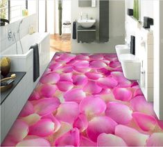 a bathroom with pink flowers on the floor