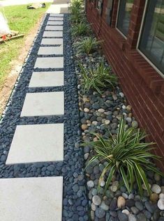 a walkway made out of stones and gravel