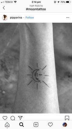 a small sun and moon tattoo on the wrist, with an arrow in the middle