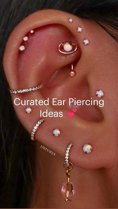 an ear with three different piercings on it