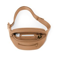 Whether you're an avid explorer or just like to keep things hands-free on the regs, The Ace Fanny Pack in Camel is your perfect companion. This waterproof neoprene pack has an adjustable strap, so you can decide how high or low your wearing style wants to go. The front and main pockets are perfect for everyday must-carry items, and there are two sneaky pockets (one interior, one exterior) great for keeping your cash and cards and other flat valuables safe and snug. This pack even has its own key Functional Leather Belt Bag For Outdoor Activities, Functional Leather Belt Bag For Outdoor, Modern Belt Bag With Adjustable Strap For Outdoor Activities, Modern Belt Bag With Adjustable Strap For Outdoor, Brown Belt Bag With Adjustable Strap For Outdoor, Outdoor Leather Belt Bag With Adjustable Strap, Functional Brown Belt Bag For Outdoor, Functional Beige Belt Bag For Travel, Neutral Bag