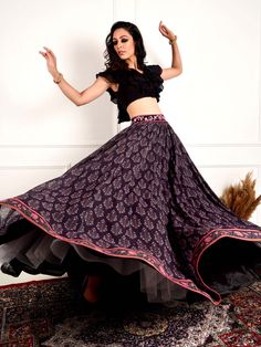 A three-piece Black Imaara Printed lehenga set from the Rashika Sharma collection. This classic black chiffon ruffle crop top blouse has a back hook opening with a V neckline. It is paired with a chiffon damask printed flared lehenga. There is embroidery on the lehenga with beads, mirror, pearls, zari and thread work. This outfit is completed with an organza-chiffon ruffle black dupatta.
Potli Bag NOT included.
Ready to ship size: Small, Medium
Ships in 1 week. Anarkali Choli With Georgette Tiered Skirt, Fitted Skirt Set With Sheer Dupatta, Bollywood Georgette Sets With Tiered Skirt, Elegant Fitted Maxi Length Choli, Traditional Georgette Sets With Tiered Skirt, Black Fitted Maxi Sets, Black Fitted Maxi Length Sets, Georgette Long Skirt Sets For Navratri, Festive Georgette Lehenga With Tiered Skirt