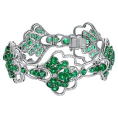 Collection quality round Colombian Emeralds weighing a total of 18.90 carats, adorned by a total of 2.28 carat E-F/VVS round brilliant diamonds, comprise this exceptional platinum bracelet. Crafted by extremely skilled hands in the USA. Length: 7 inches in length. Width: Approx. 1 inch. Returns are accepted and paid by us within 7 days of delivery. Emerald is the birthstone for May and the celebrated 35th Anniversary gemstone. Please FOLLOW the TAMIR and the MERKABA storefronts to be the first t High Jewelry Bracelet, Egyptian Bracelet, Platinum Bracelet, Retro Bracelet, Bracelet Tennis, Modern Bracelets, Emerald Bracelet, Antique Bracelets, Diamond Jewelry Designs