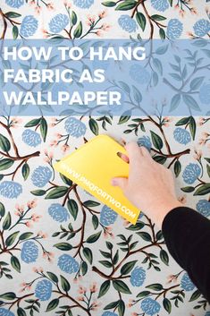 a person is using a wallpaper machine to paint flowers on a floral background with text overlay that reads how to hang fabric as wallpaper