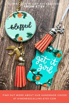 the keychain has an orange tassel and is next to a blue tag that says, be pleased get it gone