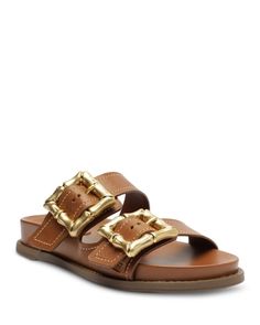 Schutz Women's Enola Sporty Slip On Buckled Slide Sandals Summer Sandals With Gold-tone Hardware And Round Toe, Summer Sandals With Gold-tone Hardware, Designer Open Toe Sandals With Gold Buckle, Summer Beach Sandals With Brass Buckle, Designer Leather Sandals With Gold Buckle, Brown Sandals With Brass Buckle, Designer Brown Sandals With Tang Buckle, Designer Sandals With Gold-tone Hardware And Round Toe, Teal Flats