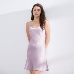 This 19 Momme silk chemise slip dress features adjustable shoulder straps and an above-the-knee length that accentuates your curves while allowing easy movement. Made of 100% Mulberry silk, the slip dress's smooth and silky texture glides over your body, providing a comfortable and effortless fit. The lightweight and breathable nature of silk makes it an ideal choice for warm nights, keeping you cool and comfortable as you sleep. Sizes are available from XS to XXL, with 7 color options to choose Elegant Chemise With Built-in Bra And Spaghetti Straps, Sleek Summer Slip Dress With Built-in Bra, Sleek Slip Dress With Spaghetti Straps And Built-in Bra, Spring Silk Slip Dress With Built-in Bra, Chic Summer Slip Dress With Smoothing Details, Elegant Sleep Chemise With Built-in Bra, Silk Slip Dress With Adjustable Straps, Summer Slip Dress With Spaghetti Straps And Smoothing, Sleeveless Smoothing Slip Dress For Summer