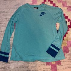 Nike Long Sleeve, Washed But Never Worn. Youth Large Or Ladies Small. Jersey Material At The Wrists. Xposted. Trendy Blue Long Sleeve T-shirt, Blue Long Sleeve Trendy T-shirt, Nike Long Sleeve T-shirt For Spring, Nike Green Long Sleeve Tops, Sporty Long Sleeve Playwear Top, Sporty Long Sleeve Tops For Playwear, Nike Blue Tops For Fall, Nike Sporty Tops For Playwear, Sporty Nike Top For Playwear