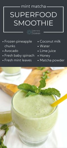 a green smoothie in a glass with mint leaves on top and the words superfood smoothie above it