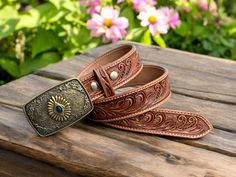 Tooled western leather belt for men cowboy style with blue stone western buckle Snap on system allows for interchanging buckles Fully handmade western leather belt hand crafted out of a single piece full grain genuine cowhide leather ABOUT THE PRODUCT: ➤High quality brass and stone buckle. ➤100% full grain genuine leather. ➤Personalized western cowboy leather belt ➤Custom engraving option. ➤ Easy Snap System for Interchanging Buckles ➤Returns from 30 days of receiving, no returns for personalize Western Antique Belt Buckles In Rectangular Shape, Western Antique Rectangular Belt Buckle, Western Style Rectangular Antique Belt Buckle, Western Style Belts And Suspenders For Rodeo, Western Belts And Suspenders With Antique Buckle, Western Belts And Suspenders With Antique Buckle For Ranch, Western Belts And Suspenders For Rodeo, Western Style Belts And Suspenders With Concho, Western Style Adjustable Belts And Suspenders With Concho