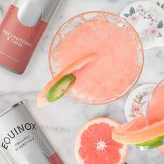 pink grapefruit and watermelon margaritas on a marble table with gin