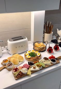 a kitchen counter topped with lots of food