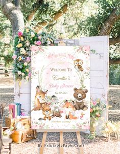 a welcome sign for a baby shower with teddy bears and flowers on the outside wall