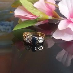 "Vintage Gold Sapphire ring, 9kt gold cluster sapphire ring, Sapphire & Diamond ring, pronise ring, engagement ring, Dress sapphire ring S15 The ring crafted in 9k yellow gold interior mark 375, anchor for Birmingham \"D\" for 1953 ring has 1 sapphire- 6,5x4,5 mm 0,70ct stone, and 2 diamonds 1,5 mm each in illusion set Ring gallery 16,2 x 6,8 mm, band 2,7 mm and 5,3 mm above the finger Total weight is 3,22  Ring size US 6,3/4 All stones are in talk, no damages or repairs. display box is not incl Cluster Yellow Gold Sapphire Ring, Cluster Sapphire Ring In Yellow Gold, Yellow Gold Cluster Sapphire Ring, Yellow Gold Sapphire Cluster Ring, Cluster Sapphire Ring With Prong Setting For Promise, Hallmarked Diamond Sapphire Cluster Ring, Hallmarked Cluster Sapphire Ring Fine Jewelry, Diamond Cluster Sapphire Ring Hallmarked, Gold Cluster Sapphire Promise Ring