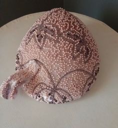 Lovely, glamorous, vintage 40's/50's pearl and glass bead encrusted Ballerina Beige Silk Satin Kippa/Fascinator Hat with decorative Mohair topknot. It is a Patrice Model design.  Measures 8 1/2" x 9 1/2". Beige lace lines the inside; Mohair trim and Beige Grosgrain sweatband; "stay-in-place" clips. Evening gown pretty, this hat is in excellent condition, an Art Deco moment in time, Avant Garde, Outrageously Cute!  I triple check measurements and for imperfections. But apologies in advance if I m Beige Silk, Wedding Fascinators, Fascinator Hat, Model Design, Moment In Time, Fascinator Hats, Top Knot, Wedding Hair Accessories, Glass Bead