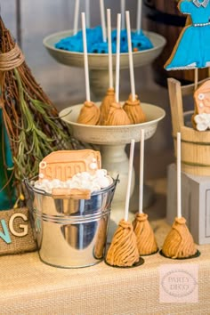 desserts are displayed in buckets and on display for guests to eat at the reception